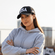 Black streetwear cap side view curved brim minimal design