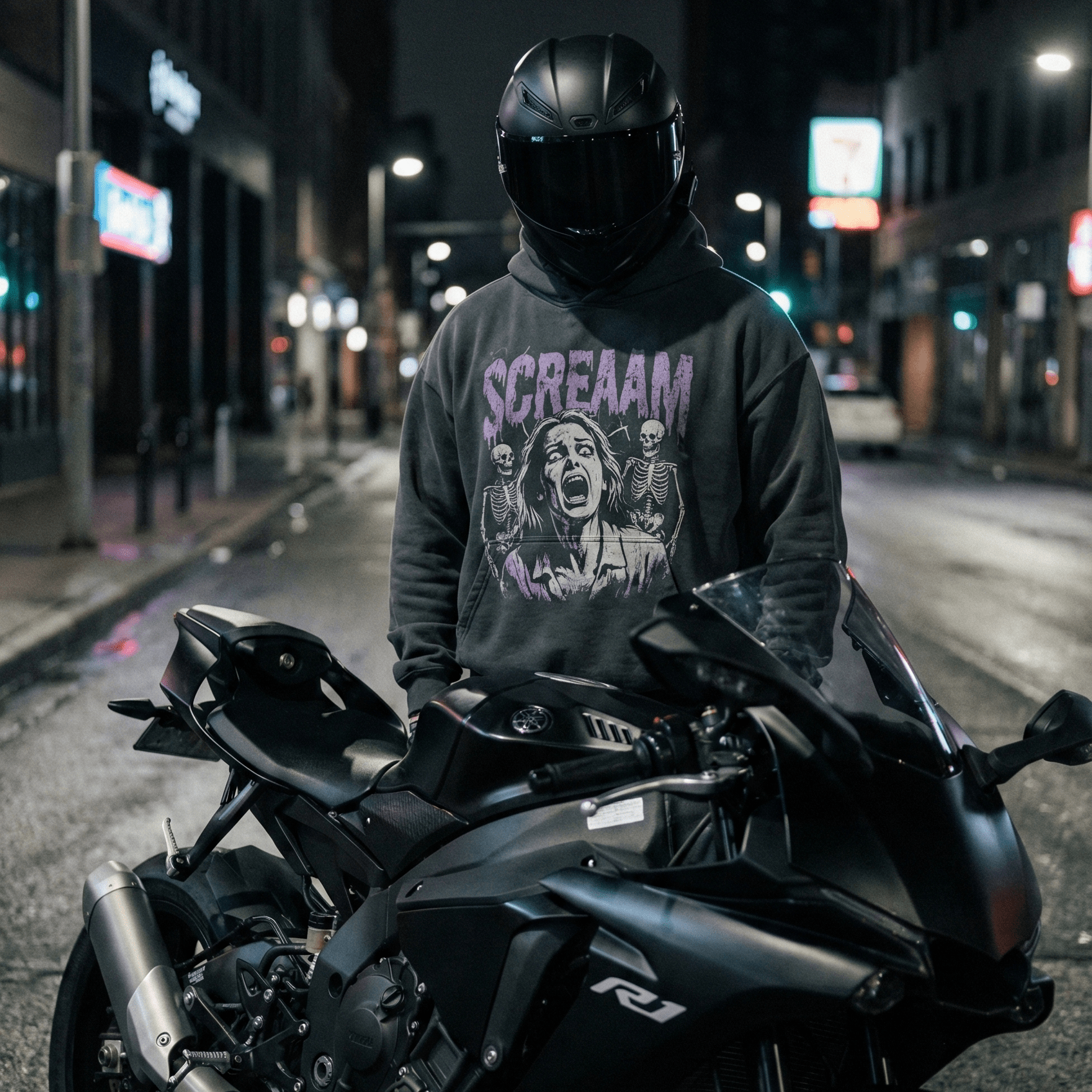 Black motorcycle hoodie paired with a full face helmet, stylish and functional riding apparel for everyday motorcycle use