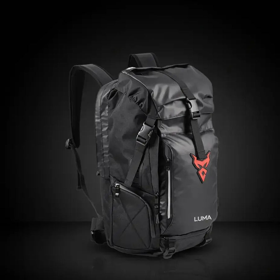 LUMA MotoPack Pro backpack front view, red logo badge, studio background