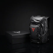 LUMA MotoPack Pro backpack beside its branded LUMA gift box