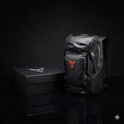 LUMA MotoPack Pro backpack and packaging box, alternate studio angle
