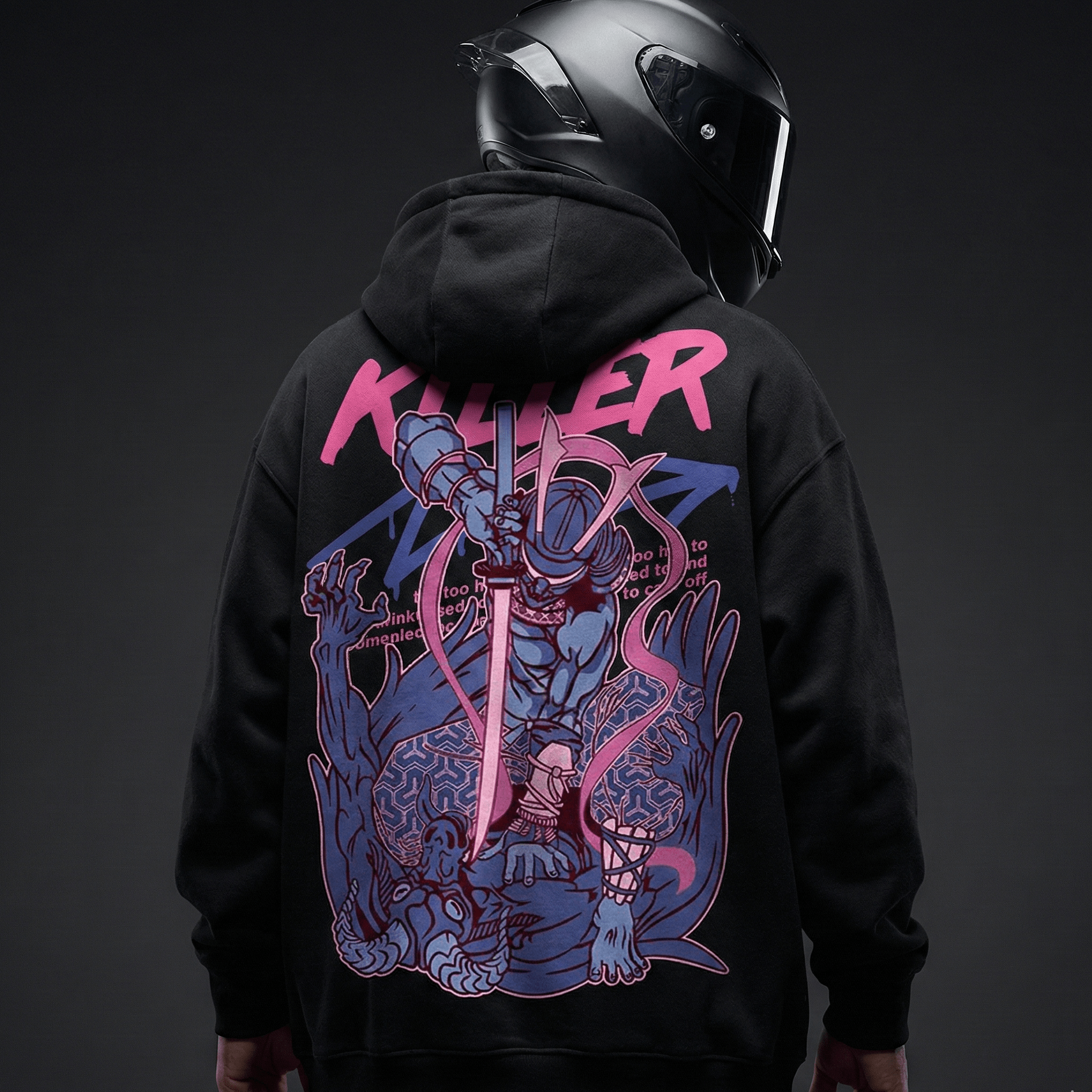 Black motorcycle hoodie with graphic back print worn by a rider with a full face helmet, premium urban biker apparel
