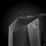 Close-up of the LUMA CarbonRide backpack's carbon-fiber top panel, zipper, and logo