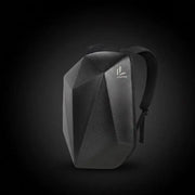 LUMA CarbonRide backpack front view with reflective logo on dark background
