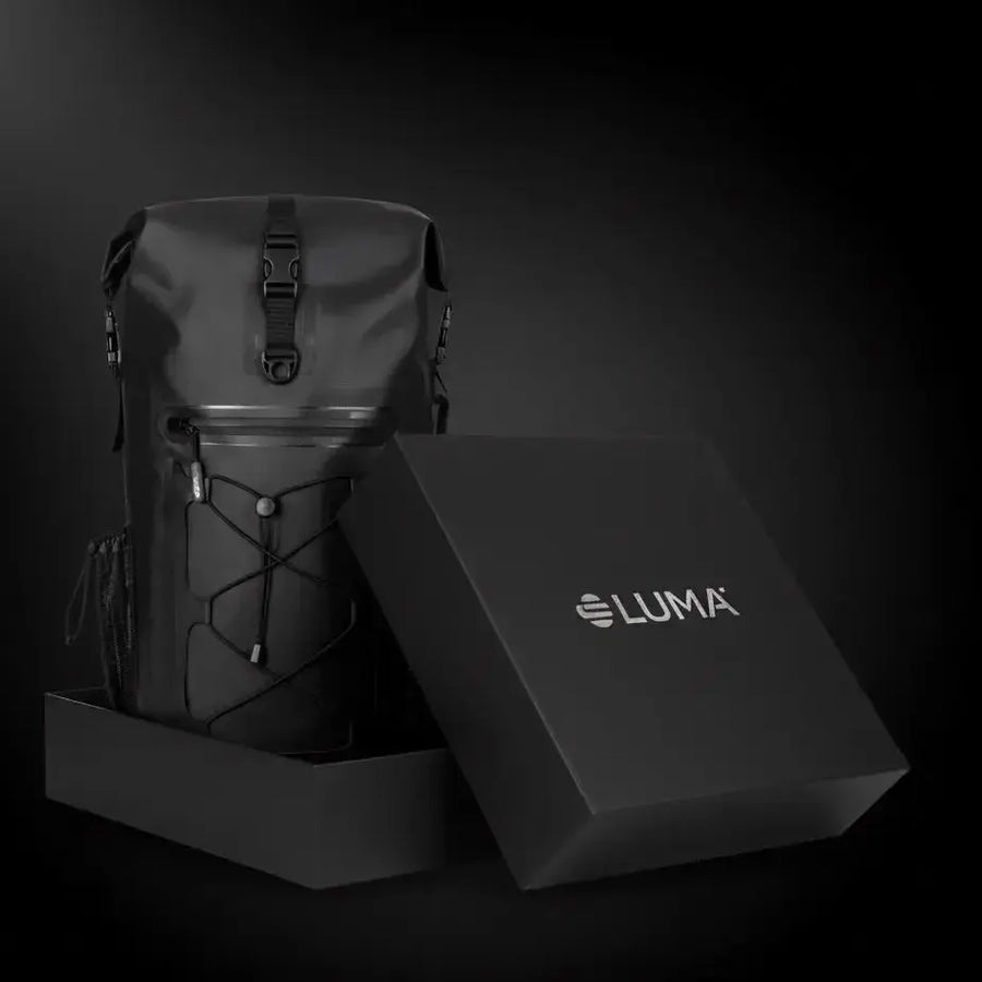 LUMA AquaRider backpack beside its branded LUMA gift box