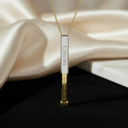 LUMA Hidden Message necklace sliding open to reveal the hidden Come Home Safe engraving