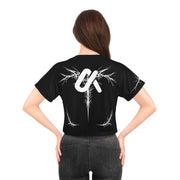 Woman wearing the LUMA Graphic Crop Tee, back view on white background