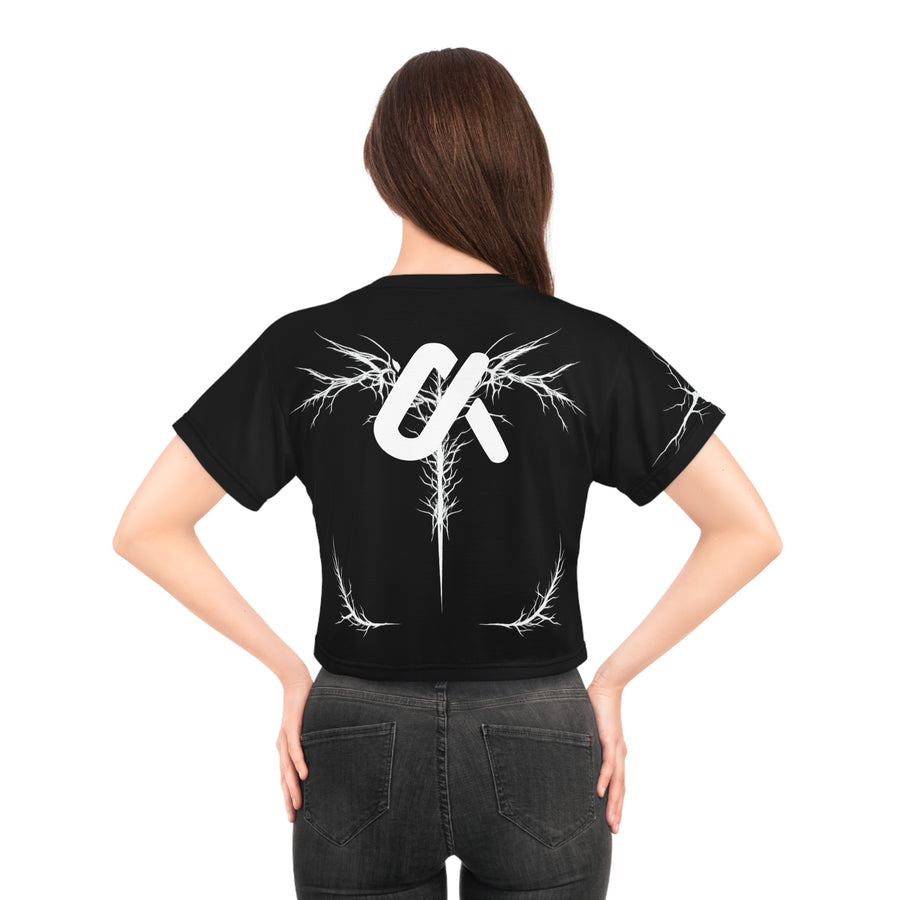 Woman wearing the LUMA Graphic Crop Tee, back view on white background