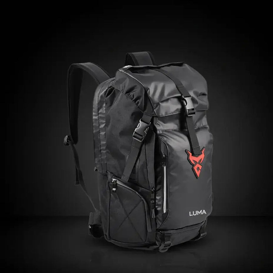 LUMA MotoPack Pro backpack front view, red logo badge, studio background
