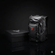 LUMA MotoPack Pro backpack and packaging box, alternate studio angle