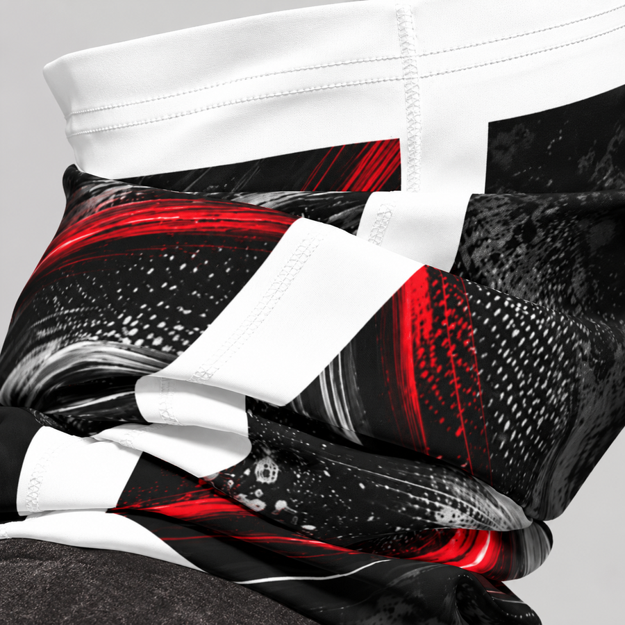 Close-up of a black, red and white patterned motorcycle neck gaiter folded at the collar