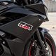 One More Lap racing sticker on the fairing of a black sportbike