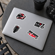 Four sportbike stickers on a silver laptop lid