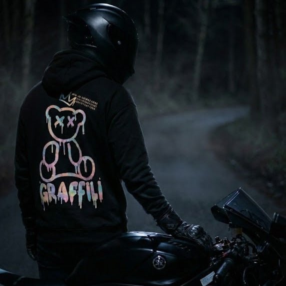 LUMA Graffiti Bear hoodie on a sportbike rider in a moody forest scene — dark aesthetic motorcycle apparel.